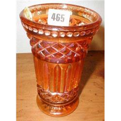 An amber carnival glass vase...