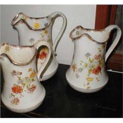 A set of three graduated water jugs c1930'...