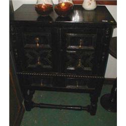 A late C19th oak cabinet in Jacobean style...