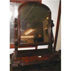 A Mid C19th mahogany swing mirror with car...