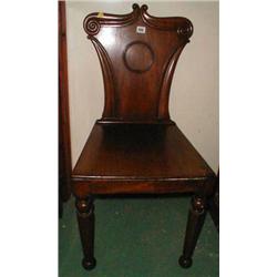 A C19th mahogany hall chair with carved de...