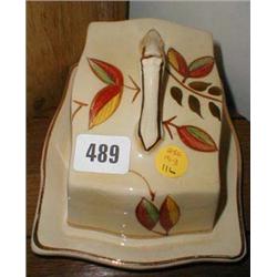 An Arthur Wood cheese dish decorated with ...