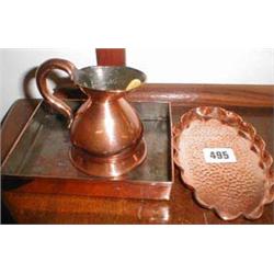 A C19th copper measuring jug together with...