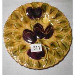 A pair of majolica plates with leaf and pl...