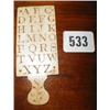 Image 1 : A C19th ivory child's alphabet paddle with...