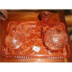 An Art Deco pink glass dressing table set...