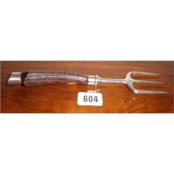 A silver bread fork with horn handle and s...