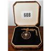 A gold (not marked) necklace with a pendan...