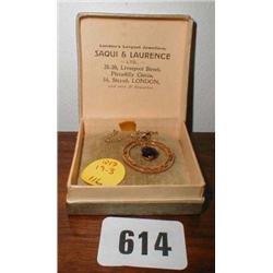 A 9ct gold chain with a 9ct gold pendant e...