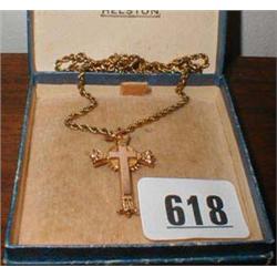 A 9ct gold cross on a chain (not gold)...