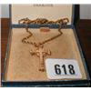A 9ct gold cross on a chain (not gold)...