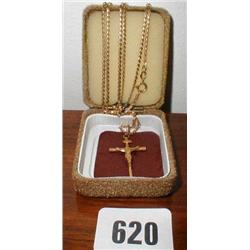 A gold crucifix on a chain...