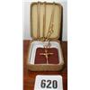 A gold crucifix on a chain...