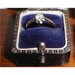 A large diamond solitaire ring with an 18c...