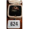 A gold garnet set band marked 375...