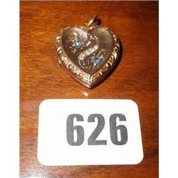 A blue sapphire and diamond heart shaped p...