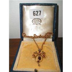 A gold 9ct pendant made up of seed pearls ...