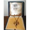 A gold 9ct pendant made up of seed pearls ...