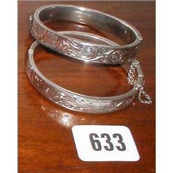 Two silver bangles with chased decoration ...