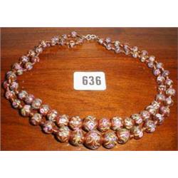 A double strung set of Venetian beads...