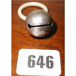 A child's silver rattle dated 1908...