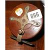 Image 1 : A 3.5" fishing reel in brass and mahogany...