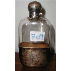 A silver-topped glass hip flask with silve...