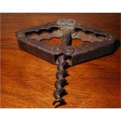 An unusual steel hinge-action corkscrew...