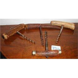 Four horn handled corkscrews...