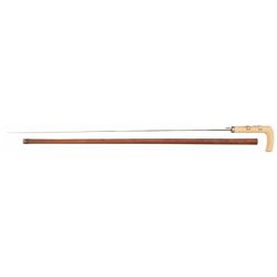 Unique Silver Fitted Sword Cane with a Relief Carved Ivory Handle