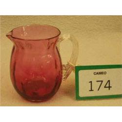 Small cranberry glass jug with reeded handle...