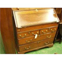 Antique oak bureau with stepped interior and...