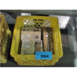 Yellow milk crate of assorted stanley bostich