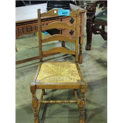 Solid oak with rush seat ladder back side chair