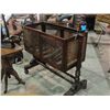 Image 1 : Mahogany turn of the century swinging craddle on