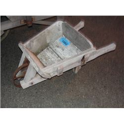 Rustic wooden wheel barrow with steel wheel