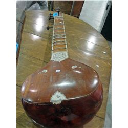 Hand crafted wooden stringed instrument