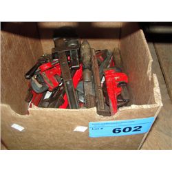 Box full of assorted vintage pipe wrenches