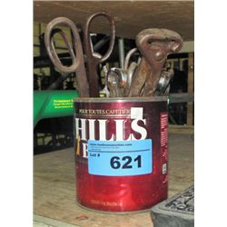 Container filled with assorted cutters and snips