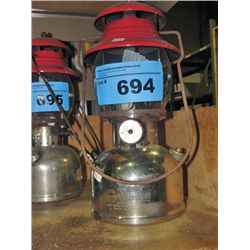 Chrome and red coleman camp lantern