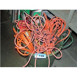 Garbage can filled with assorted extention cords and heavy duty power cords