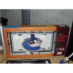Neon license plate clock with vancouver canucks emblem