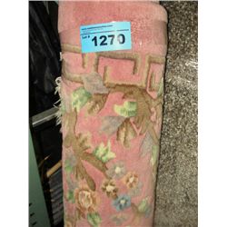 Pink wool and floral area rug