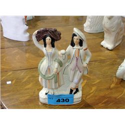 Staffordshire gentleman and lady pottery figurine