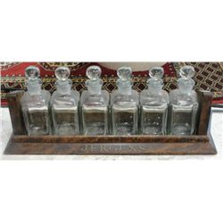 Jergens pharmacist stand and 6 original glass