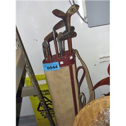 Early 1900s wood handled golf club set with bag