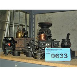 collection of cast metal toy stoves, kettles,