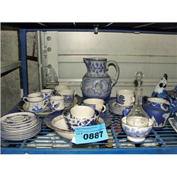 shelf lot of assorted blue and white dinnerware