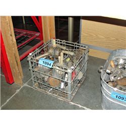 Vintage steel milk crate filled with assorted