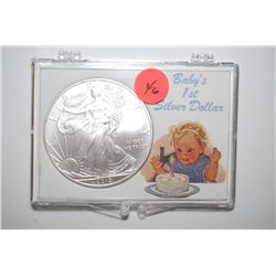 2010 Silver Eagle $1 In Baby's 1st Silver Dollar Holder; EST. $35-40